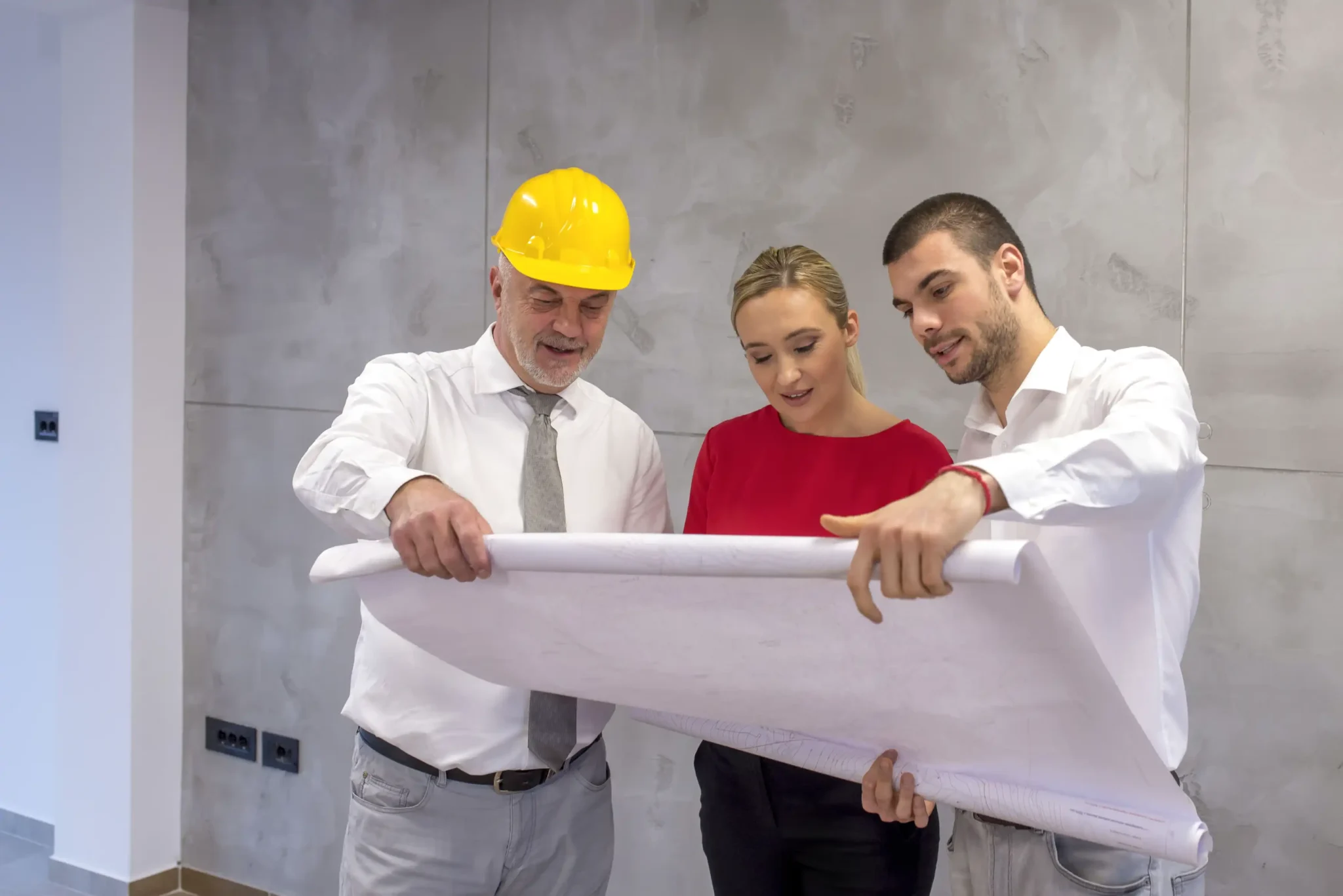 General contractor discussing project plans with homeowners.