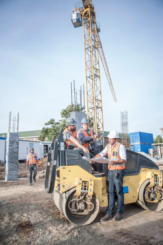 Construction site with workers and equipment demonstrating active construction management.